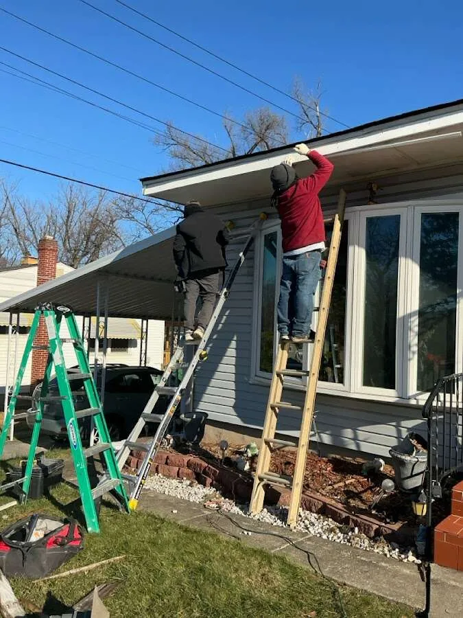 Restoration crew performing exterior repair in Queensbury