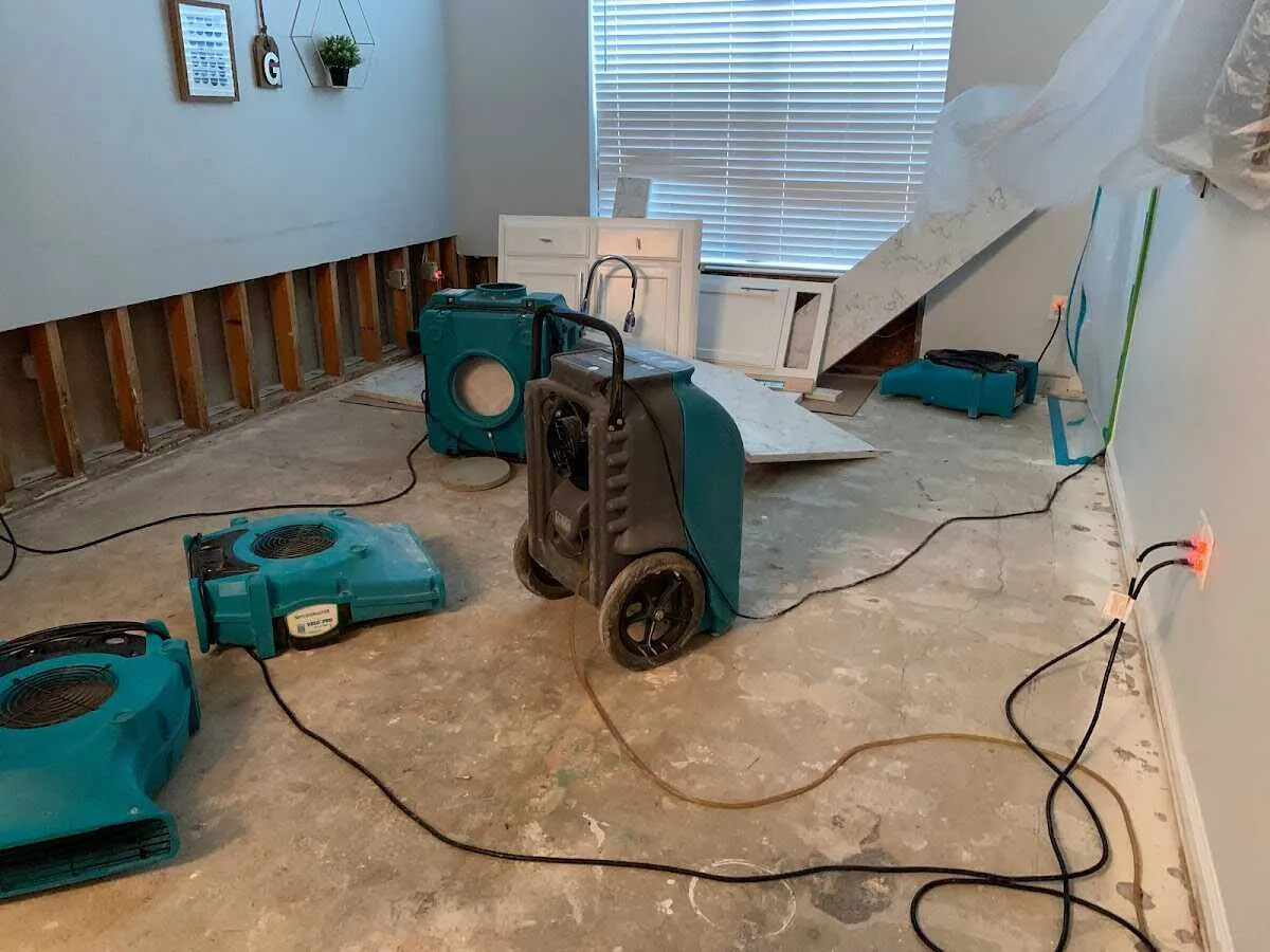 Dehumidifier in flood-cut room for Water Damage Restoration in Queensbury